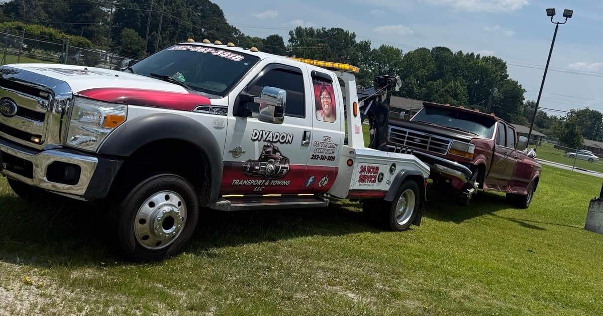 Divadon Transport & Towing flatbed with a vehicle load on NC 43 in Greenville, NC